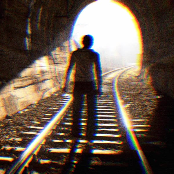 A person approaching the end of a tunnel, unsure of what lies on the other side.