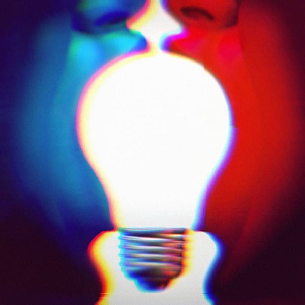A Blue face and a Red face turned towards each other with their mouths open. Each person is holding the side of a lightbulb in their mouth. Bipartisan concept.