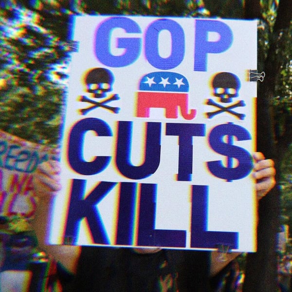 A protest sign that says GOP Cuts Kill with skulls