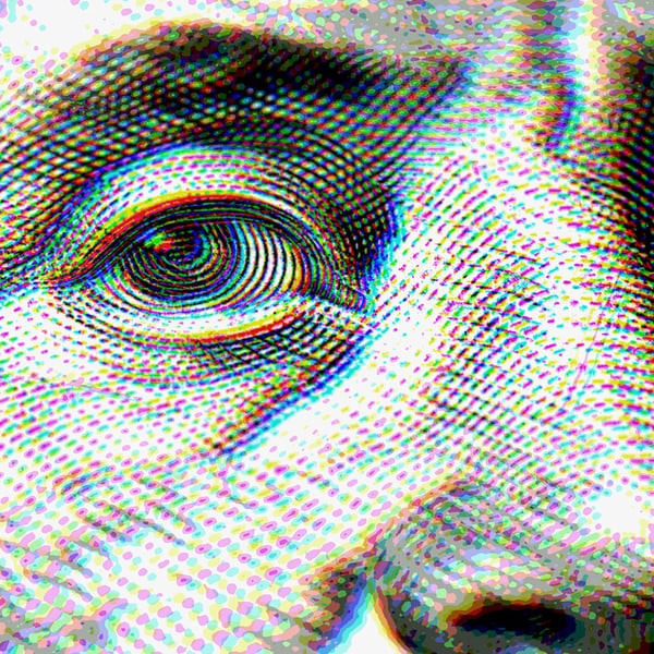  Closeup on money showing a president's eye and nose.