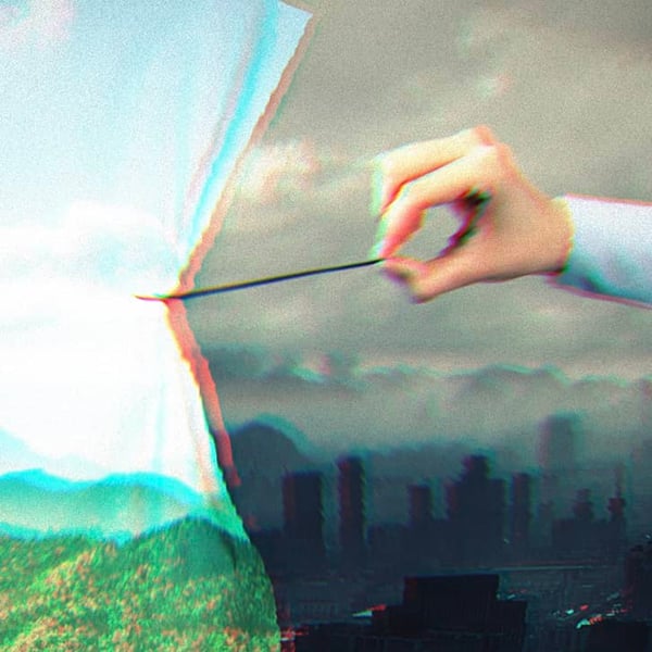 Someone pulling a curtain with image of mountains, green grass and nature over a grey, smoggy cityscape.