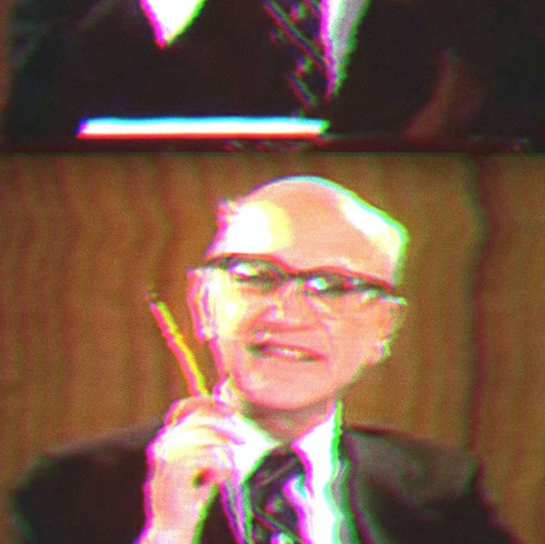 Milton Friedman Holding a Pencil.