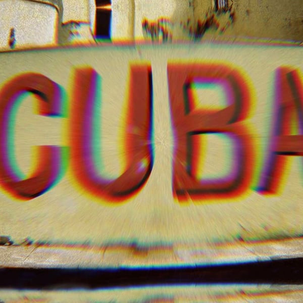 Mural that says “Cuba.” A filter on the photo gives the word Cuba a rainbow glow.