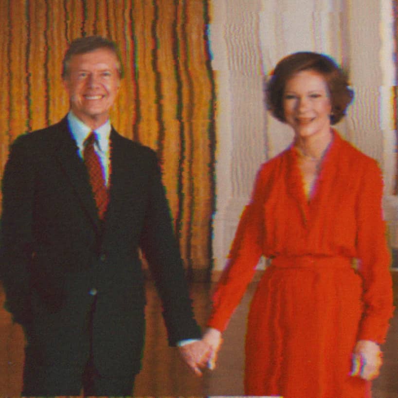 Photographic portrait of Rosalynn and Jimmy Carter holding hands in the White House.
