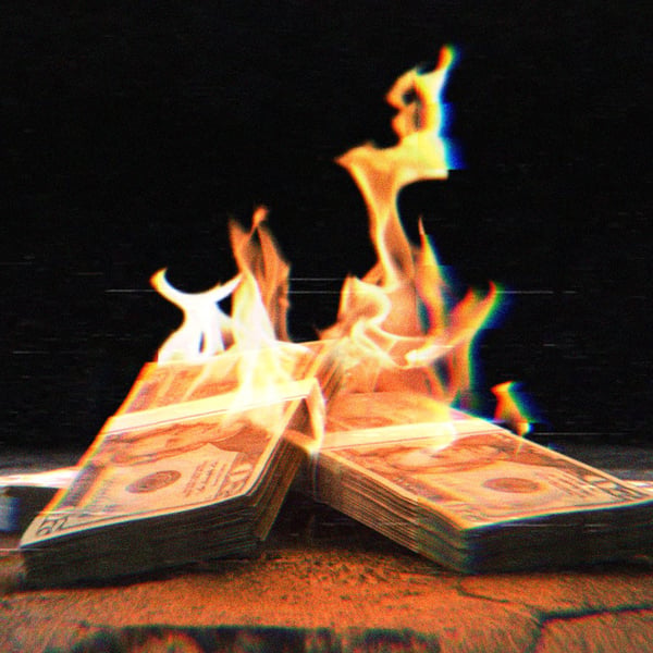 Stacks of $20 bills on fire
