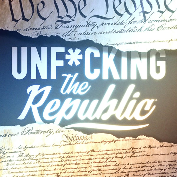 Image of the US Constitution ripped in the middle revealing white text on a blue background that says, ‘Unf*cking the Republic.