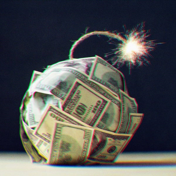 A ball of $100 bills with a lit fuse on the end.