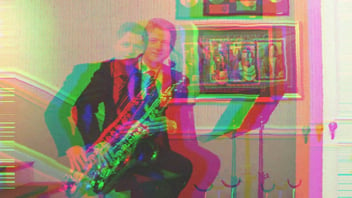 Bill Clinton in the White House music room, holding his saxophone.
