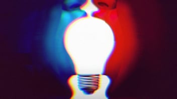 A Blue face and a Red face turned towards each other, with their mouths open. Each person is holding the side of a lightbulb in their mouth. Bipartisan concept. 