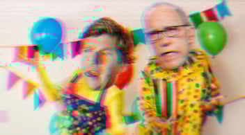 Composite of Tucker Carlson and Larry Kudlow with their heads on clown bodies.