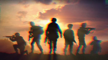 Six military silhouettes on a sunset sky background.