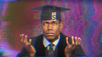 A young graduate wearing a cap and gown, shrugging and looking up at his graduation tassel, which is a tag with a dollar sign on it. 