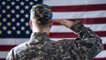 A U.S. solider saluting the American flag.