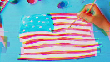 A child painting a picture of the American flag.