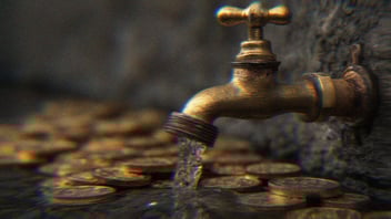 A faucet leaking water onto gold coins.