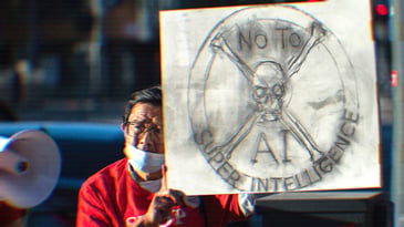 A man holding a sign with a skull and crossbones that says ‘No To AI Superintelligence.’