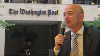 An image of Jeff Bezos speaking into a microphone overlayed on an image of the former Washington Post headquarters.
