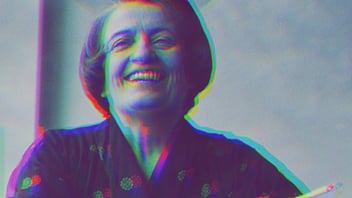 Ayn Rand smoking and laughing. She has faint devil horns appearing on her head.