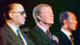 Begin, Carter, and Sadat at a ceremony in September, 1978. Carter is in focus and has his hand over his heart with his eyes closed.
