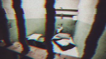 Distorted image of a jail cell.