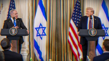 Donald Trump and Benjamin Netanyahu holding a joint press conference. American and Israeli flags are seen behind them.