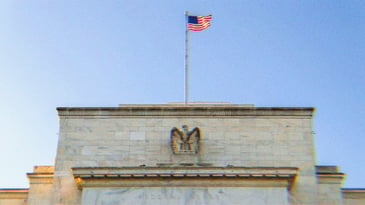 The Federal Reserve building. The words ‘Federal Reserve’ are visible, as is an eagle and the American Flag.