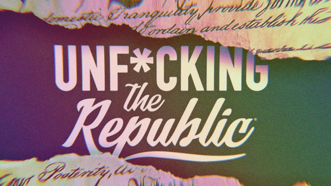 The US Constitution ripped in the middle revealing white text on a blue background that says, ‘Unf*cking the Republic.’ Letters have a glitchy rainbow effect on them-Dec-20-2024-10-06-35-6614-PM
