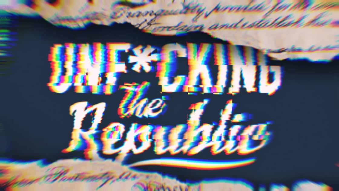 The US Constitution ripped in the middle revealing white text on a blue background that says, ‘Unf*cking the Republic.’ Letters have a glitchy rainbow effect on them-Oct-12-2022-03-03-27-04-PM