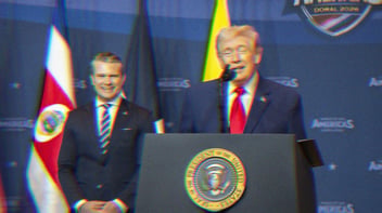 Trump is speaking at a podium. Pete Hegseth stands behind him, smiling.