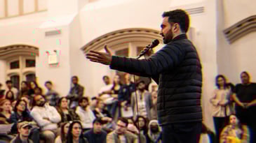 Zohran speaking to a group of DSA members.