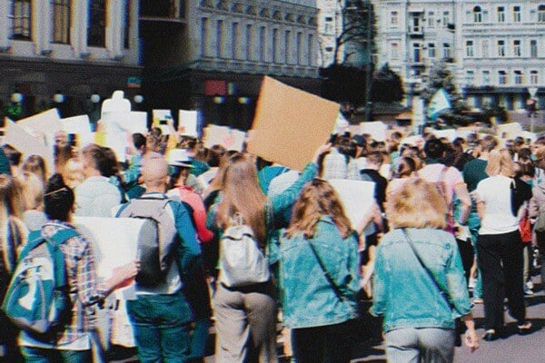 Protesters walking through the streets with signs