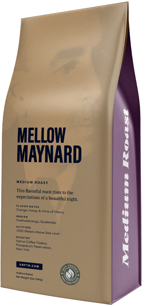 Coffee bag for the Mellow Maynard blend. A ghosted out photo of John Maynard Keynes appears in the background and the side of the bag is light purple with the words Medium Roast