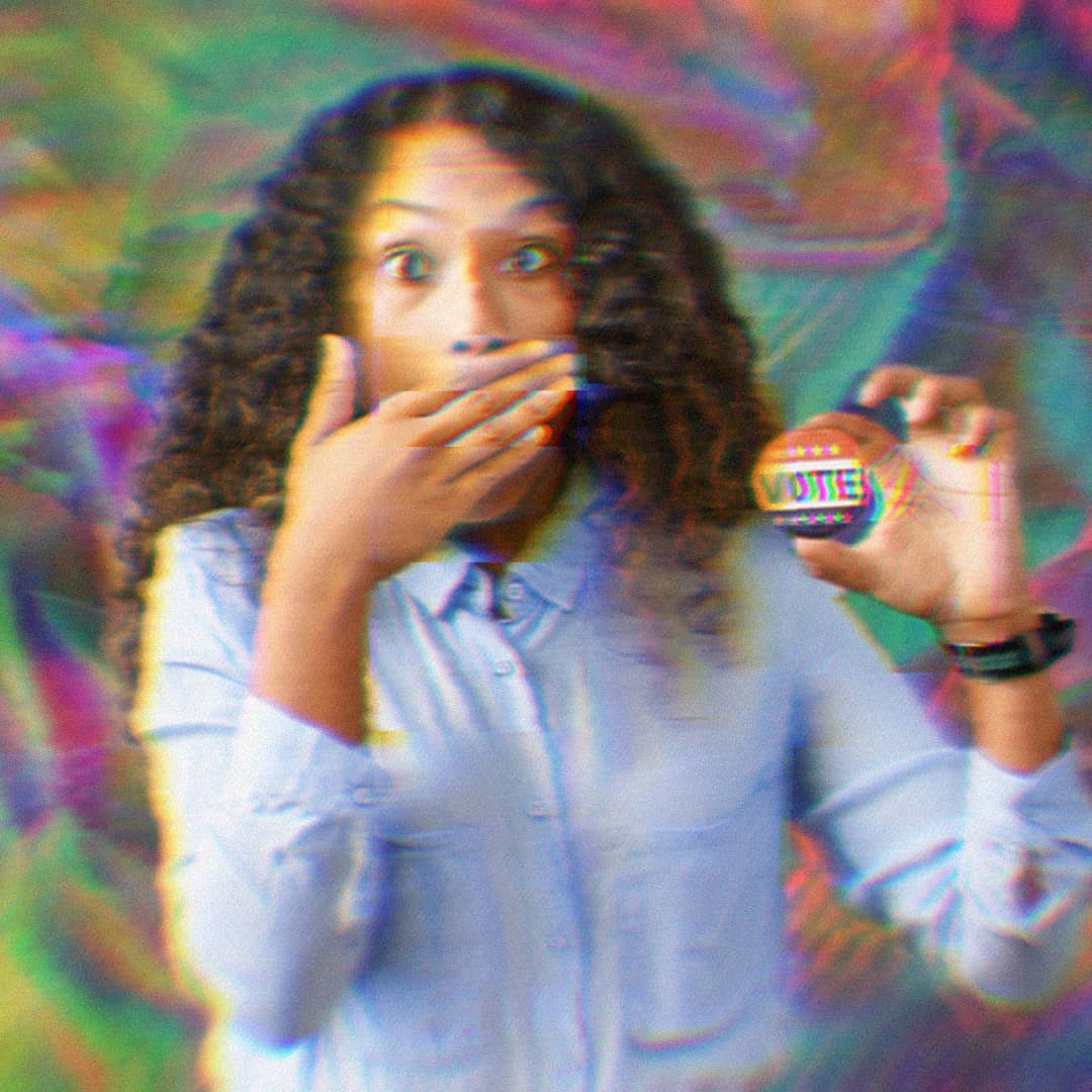 A woman covers her mouth with her hand in shock and holds a button that says 'Vote.' The background is rainbow and trippy.