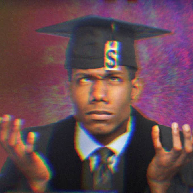 A young graduate wearing a cap and gown, shrugging and looking up at his graduation tassle which is a tag with a dollar sign on it