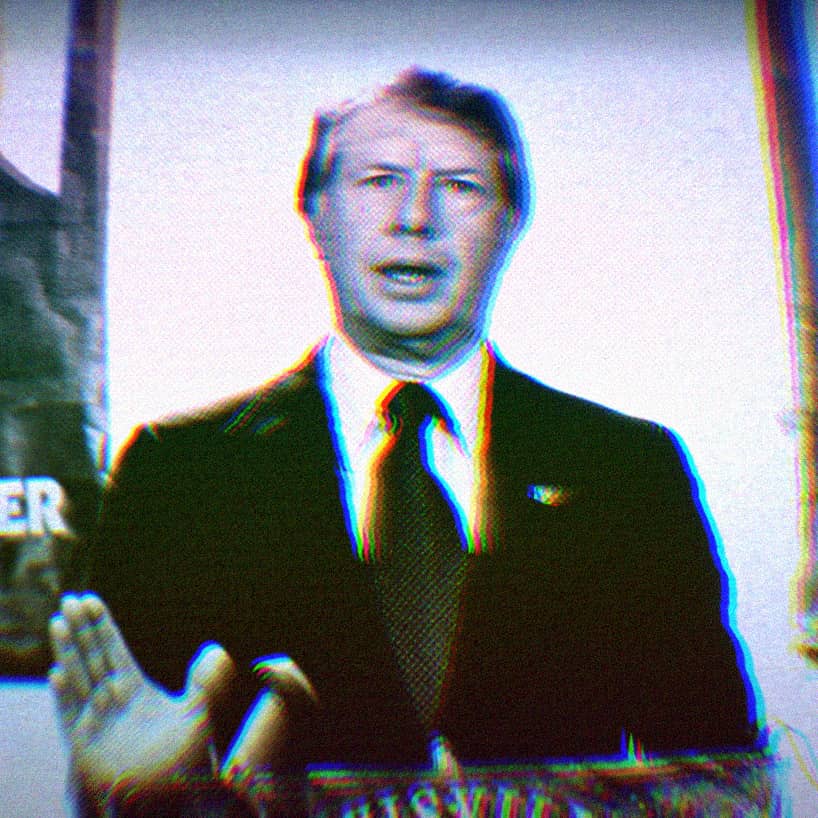 Aged photo of President Jimmy Carter making a speech in a dark suit