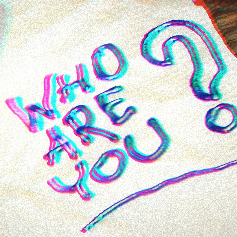 Rainbow writing on a napkin that says Who Are you? 