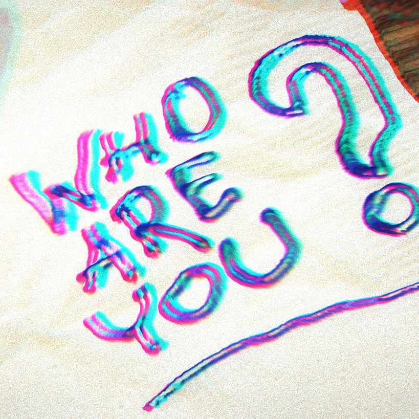 Rainbow writing on a napkin that says Who Are you?