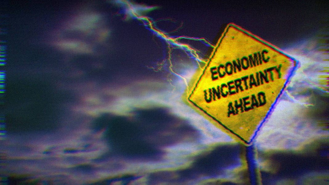 Lightning hitting a yellow road sign that says, 'Economic Uncertainty Ahead.'