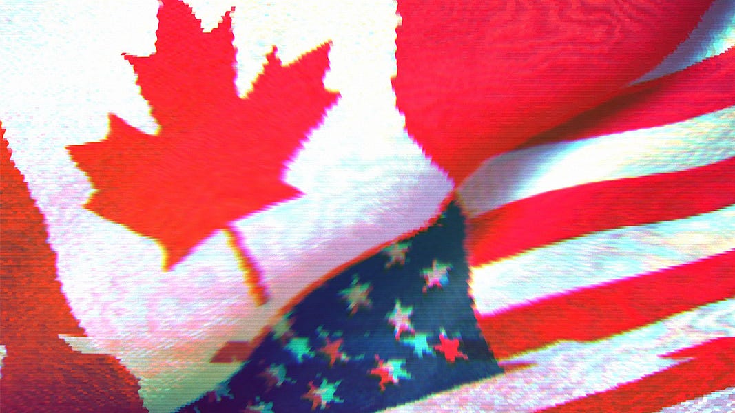 American and Canadian flags next to each other.