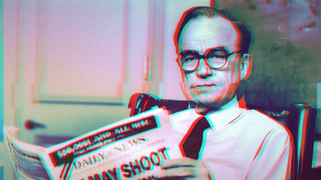 An old photo of Rupert Murdoch sitting in a chair holding a newspaper. A photo filter makes the image glitchy, with red and blue streaks clinging to the edges of Murdoch.
