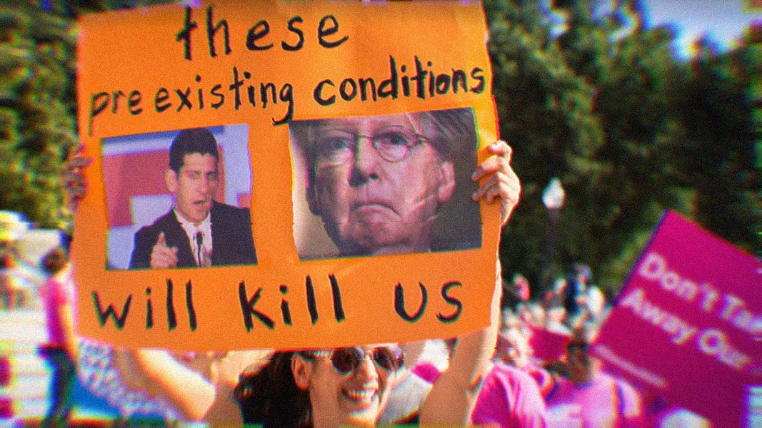 A woman holding a protest sign that says, 