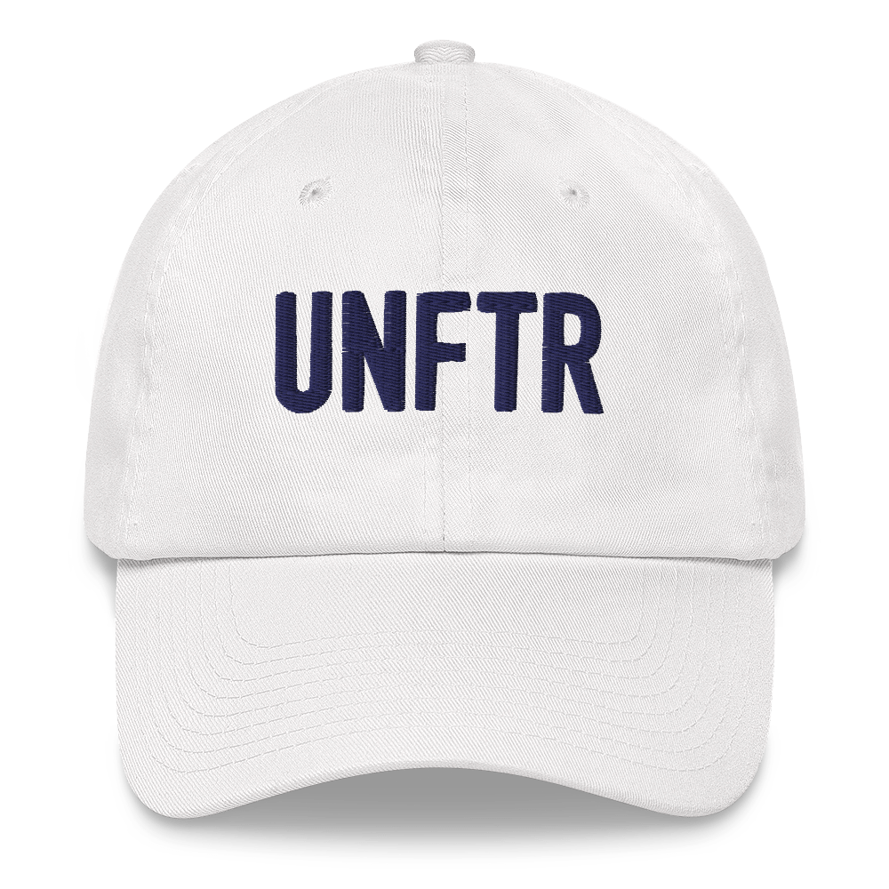 White dad hat with navy embroidered UNFTR logo