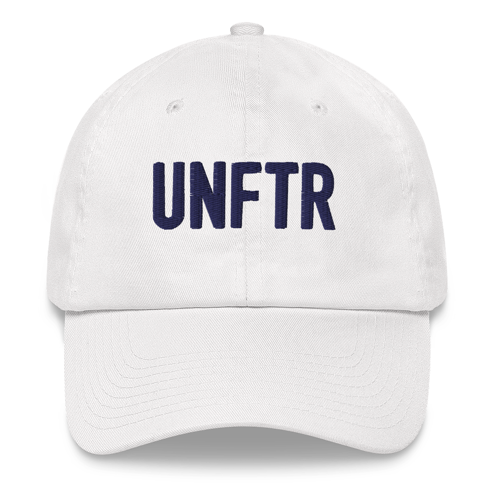 White dad hat with navy embroidered UNFTR logo