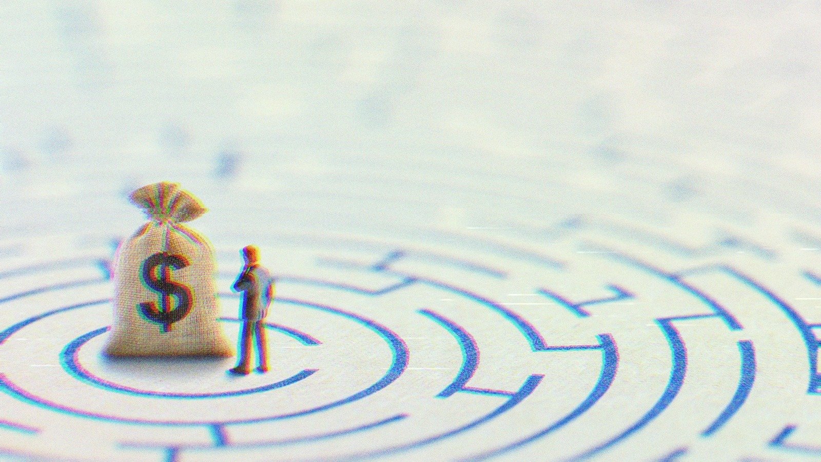 A miniature figurine looking at a sack with a dollar bill on it.