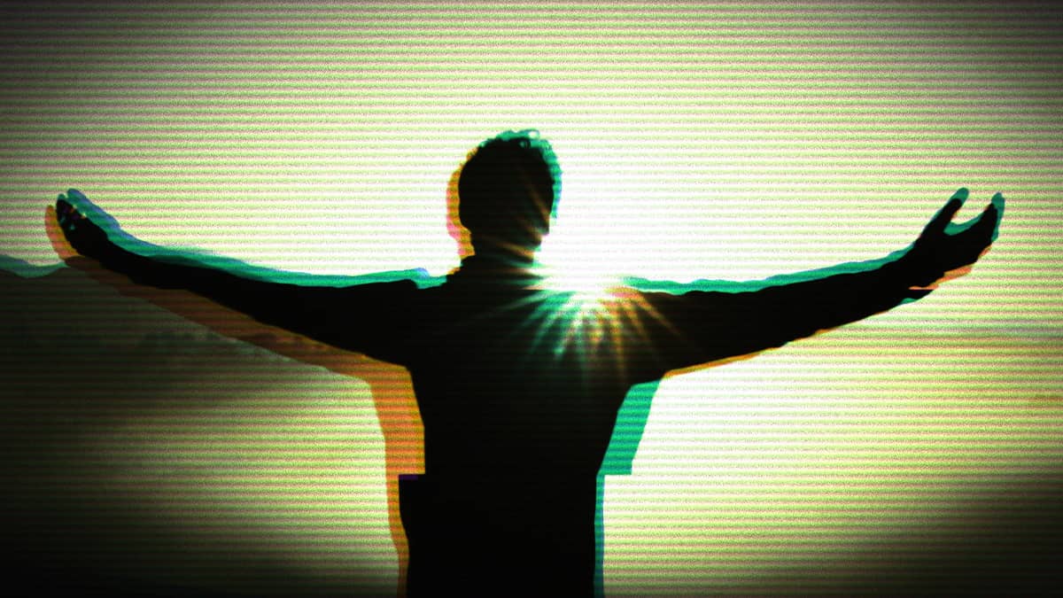 A person with their arms outstretched towards the sun. 