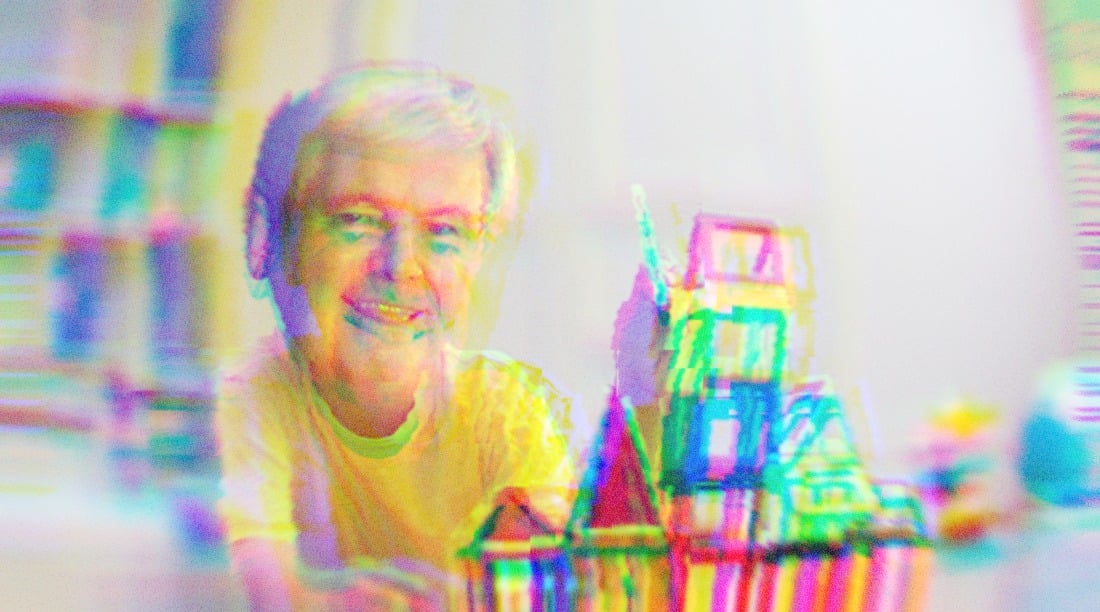 Newt Gingrich building a toy house with blocks.