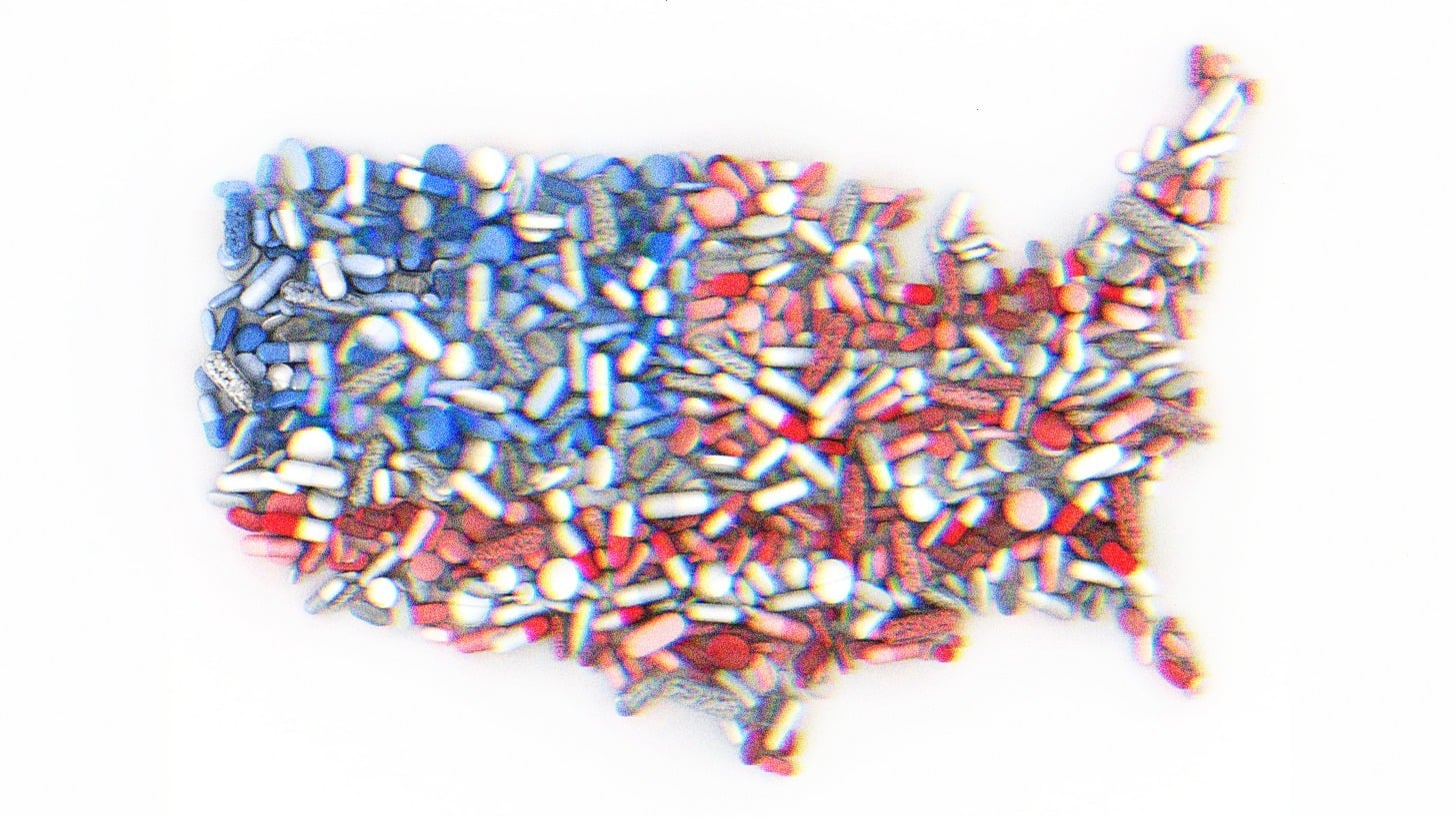 Pills in the shape of the United States, colored like the American Flag.